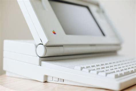 Macintosh Portable Computer on Wooden Desk