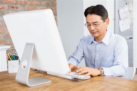 Image result for IA Smiling Man Using a Computer On Home Desk