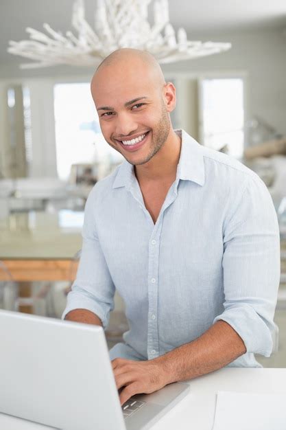 Image result for IA Smiling Man Using a Computer On Home Desk