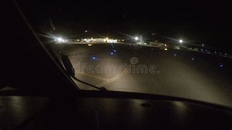 Plane Landing at the Airport during the Night. the View from the ...