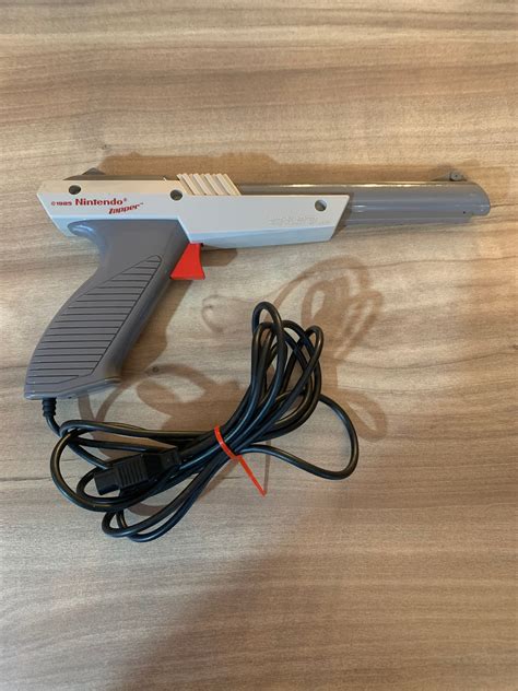 Image result for NES with Gray Gun and Track Pad
