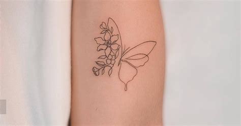 One line butterfly flower tattoo located on the inner