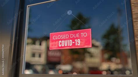 Close-up on a closed sign in the window of a shop displaying the ...