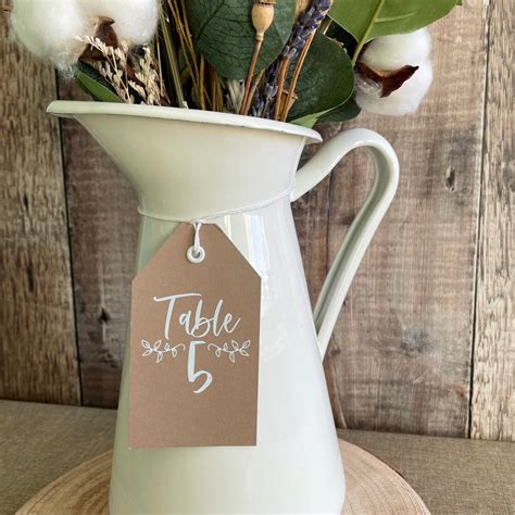 Toradh íomhá ar Rustic Table Setting Tags Numbers