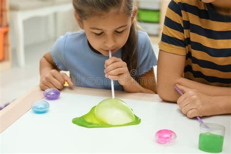 Image result for Child Playing with Slime at Table