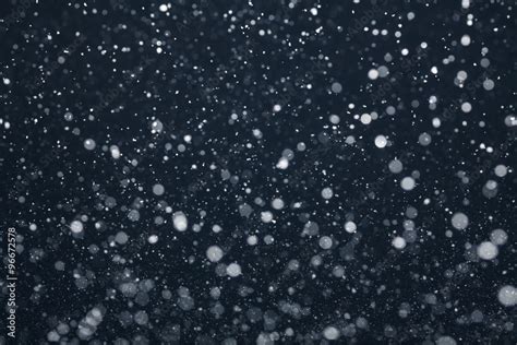 Snow Falling from Night Sky Stock Photo | Adobe Stock