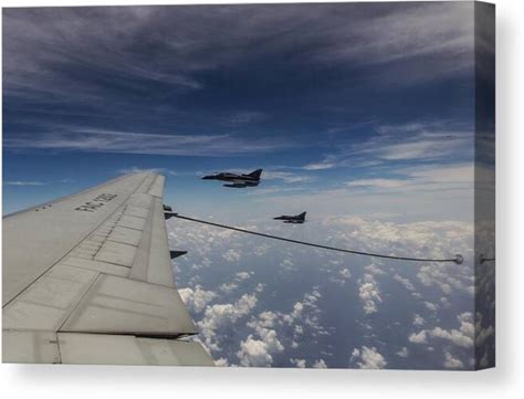 Extreme Landscape Canvas Print By Assaf Gavra | Jets Flying Over A Vast Ocean