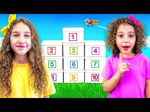 Sierra and Rhia open boxes with surprises to learn the numbers 1-10.