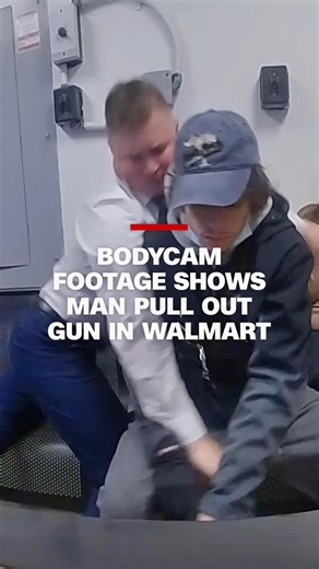 Body camera footage shows the moment police say a 21-year-old shoplifting suspect pulled a gun out and tried to shoot an officer at a Walmart in Canton, Ohio. The suspect has been charged with attempted murder, according to police. | CNN