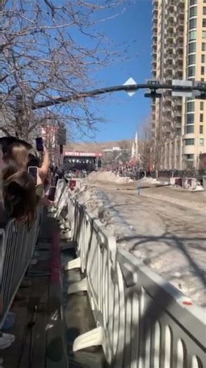Horses Pull Skiers Down Snowy Street for Big Jumps