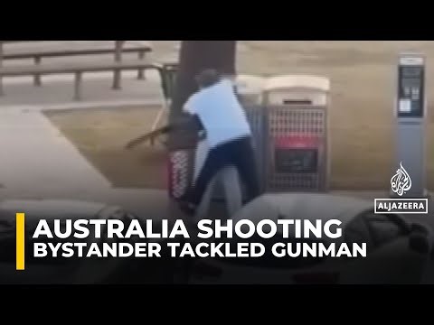 Video shows bystander tackling and disarming one of the shooters at Sydney’s Bondi Beach