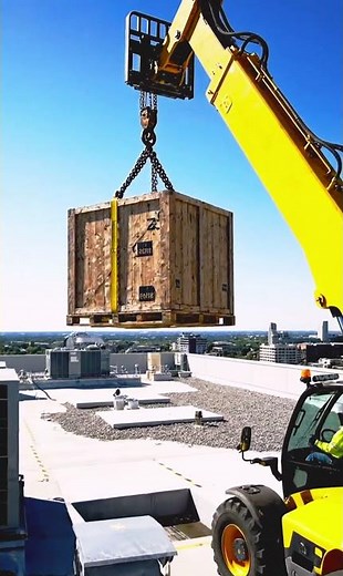 Telehandler Lifting Equipment Crate to Rooftop #Telehandler #BoomLift #IndustrialFootage #shorts