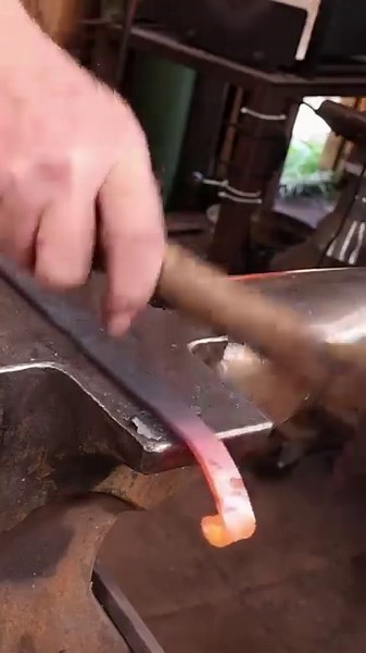 Forging decorative metal scrolls by hand