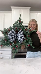 Another Dollar Tree hack using mini Christmas trees 🎄 How pretty and simple is this snowflake wreath?!! 🥰 With the exception of the ribbon, everything was purchased from Dollar Tree. I’m considering adding lights…🫣😭 I guess it depends on where I decide to hang it. What do you think? #christmas2023 #christmasiscoming #christmasdiy #christmasdecorations #foryoupagereels #fypシ゚ #dollartreehacks | Laura Jeanne