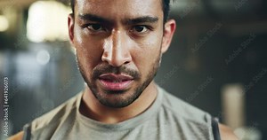 Man, sweating face and breathing in gym for fitness challenge, exercise endurance or break. Serious portrait, strong asian bodybuilder and tired for training, workout fatigue and breathe for recovery