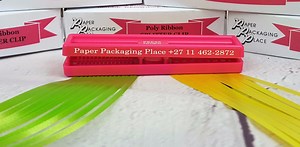 The Splitter Clip turns ordinary poly ribbon into works of art. It splits & curls ribbon but also can be used to make the most wonderful creations for gifts, entertaining or just about anything. | Paper Packaging Place