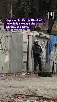 Police evict hundreds of migrants from a squat in Spain.
