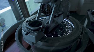 Direction finder at vessel's bridge. Navigation device. Compass needle rotates