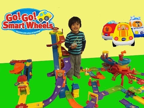 Kid playing with toys Vtech Go Go smart wheels toys