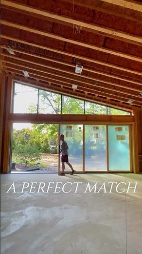 This five-panel MultiGlide™ Door is configured to match the custom windows above.