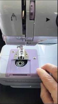Mini sewing machine with thread and bobbin installation