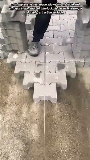Efficiently installing interlocking pavers with expert skill.
