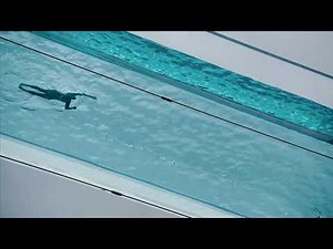 Watch a swimmer in London's fully transparent Sky Pool