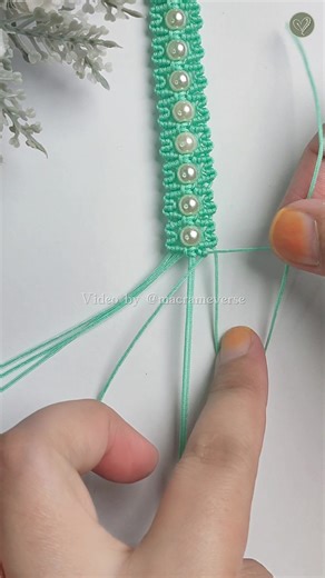 Learn how to create a macrame bracelet using 0.8 mm nylon threads, complete with a delicate pearl bead accent in the center. Simple, elegant, and perfect for everyday style. #tutorial #macramebracelet #threadbracelet #craftideas #handmade | Macrameverse
