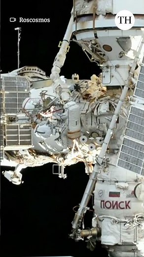 Cosmonauts install science equipment at ISS