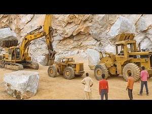 Excavator vs Wheel Loader: The Epic Battle to Lift Giant Marble Rocks!