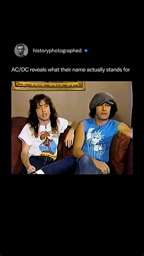 The band AC/DC has consistently revealed that their name stands for "Alternating Current/Direct Current" electricity. The name originated when the Young brothers' sister, Margaret, saw the abbreviation on the back of her sewing machine and suggested it to the band, as they felt it perfectly symbolized their raw, high-energy rock and roll sound. Credit: Entertainment Tonight | History In Pictures