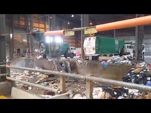 Garbage Trucks and Street Cleaner unload at Tip for Bull Dozer