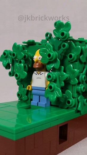 A small mechanical model of Homer emerging from, and backing into, the bushes. Instructions and full kit are available on Rebrickable and BuildaMOC (links in bio). Designed in collaboration with Dustin Lebel, a fellow ParLUGment member. When he brought his original to a meeting a few months ago, I was blown away with his novel approach for separating the leaves. The result is a nice compact model, making a great little desktop display. #jkbrickworks #lego #simpsons | JK Brickworks