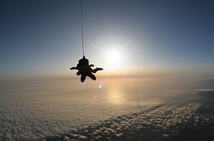 Stunning Skydiving Photo Complete with Rocket Launch in the Background