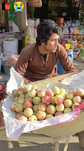Sorting Fresh Apples at the Outdoor Market