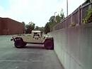 Humvee climbing vertical wall.