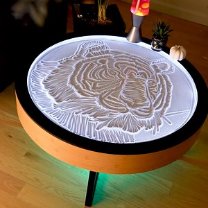 3.1K views · 12 reactions | Imagine a coffee table that’s more than just furniture – it’s a mesmerizing work of art. Our Oasis kinetic art coffee table uses a small ball controlled by a hidden magnet to create intricate sand patterns that are soothing to watch. | Grounded Labs | Facebook