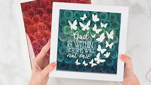 Today I am sharing with you how to make a DIY shadow box with rolled paper flowers! For an extra touch, I will also show you how to add permanent vinyl on the front of the glass. You can grab my FREE wavy rosette flower template and rolled flower sizing chart on the blog! | Abbi Kirsten Collections