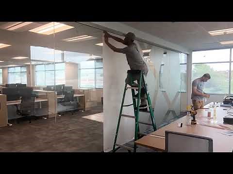 Installing Frosted Vinyl Graphics to the Glass of Office Windows, Doors, and Interiors