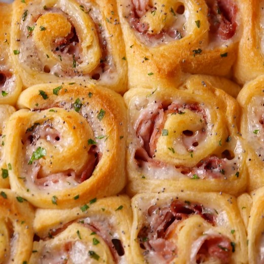 Ham & Cheese Roll-Ups are the most genius way to use crescent rolls. Full recipe: http://dlsh.it/WseRTxC | Delish