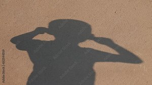shadow of child is having fun. Blur shadows of child on wall. Game with light and shadow. Shadow play