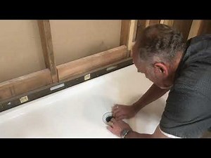Installing a seal and castle nut on shower pan compression drain