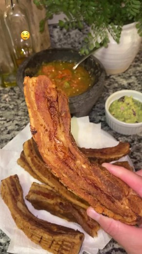 Chicharron 🥓 Recipe: 1. Bring to boil a pot of water. Add 1/2 tsp of cloves, a whole garlic head, 2 bay leaves, 1/4 of onion, and thick strips of pork belly. 2. Add 1/4 cup of vinegar, 1/4 cup of salt and 1 tbsp of black pepper. Stir well. 3. Let it simmer in medium low heat for 30 min. 4. Remove pork belly from pot then create some slits on top of strips. 5. Melt 6 cups of Lard ( pig fat ) then once it’s nice and hot place pork belly into pot. Fry for 30 min in medium low making sure to move t