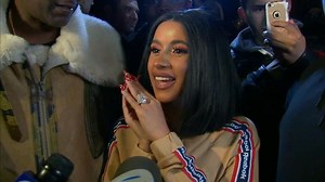 Cardi B swarmed as she hands out free winter coats in Brooklyn