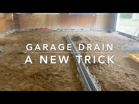 Trench drain instal for a garage.