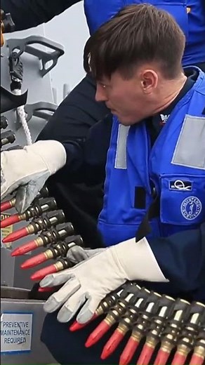 US Navy Sailors reloading Phalanx close-in weapon system