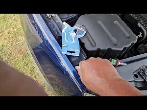 How to replace a Saturn headlight bulb.