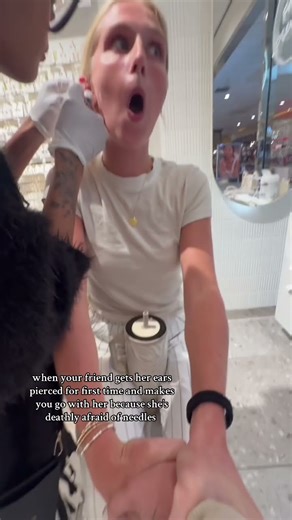Young Woman Gets Her Ears Pierced For The First Time