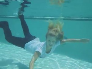 @TrinaMason Playboy Miss Social model Trina Mason fully clothed underwater swimming pool happy