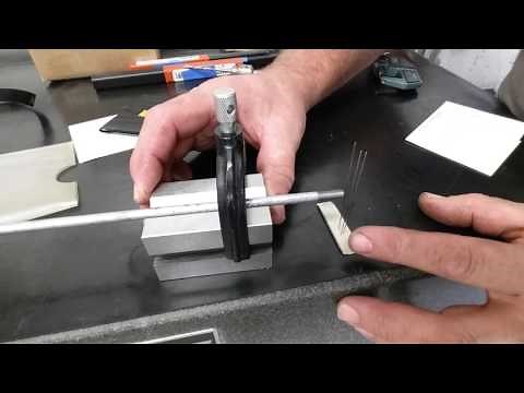 Using the 3 wire method for measuring thread pitch.